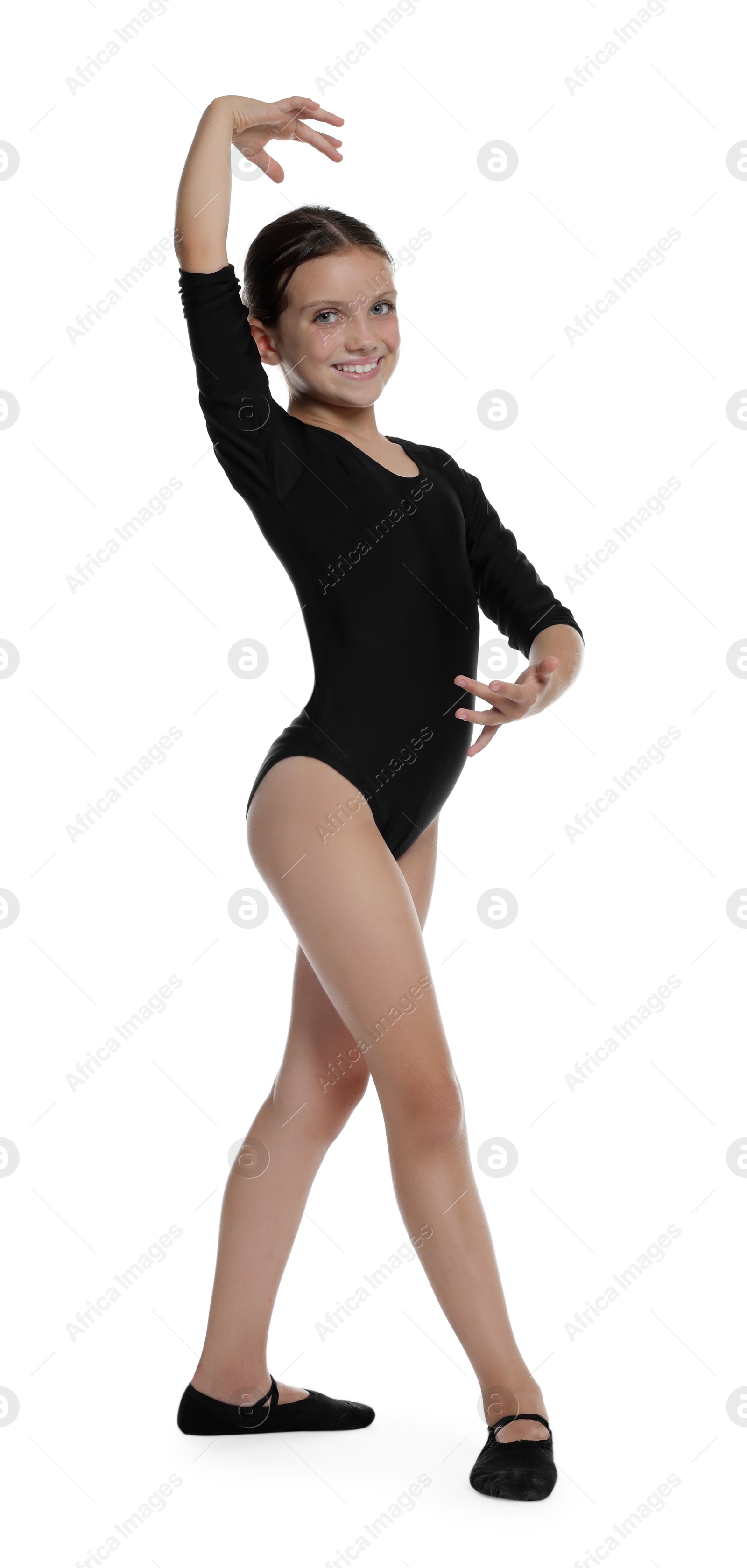 Photo of Little ballerina practicing dance moves on white background