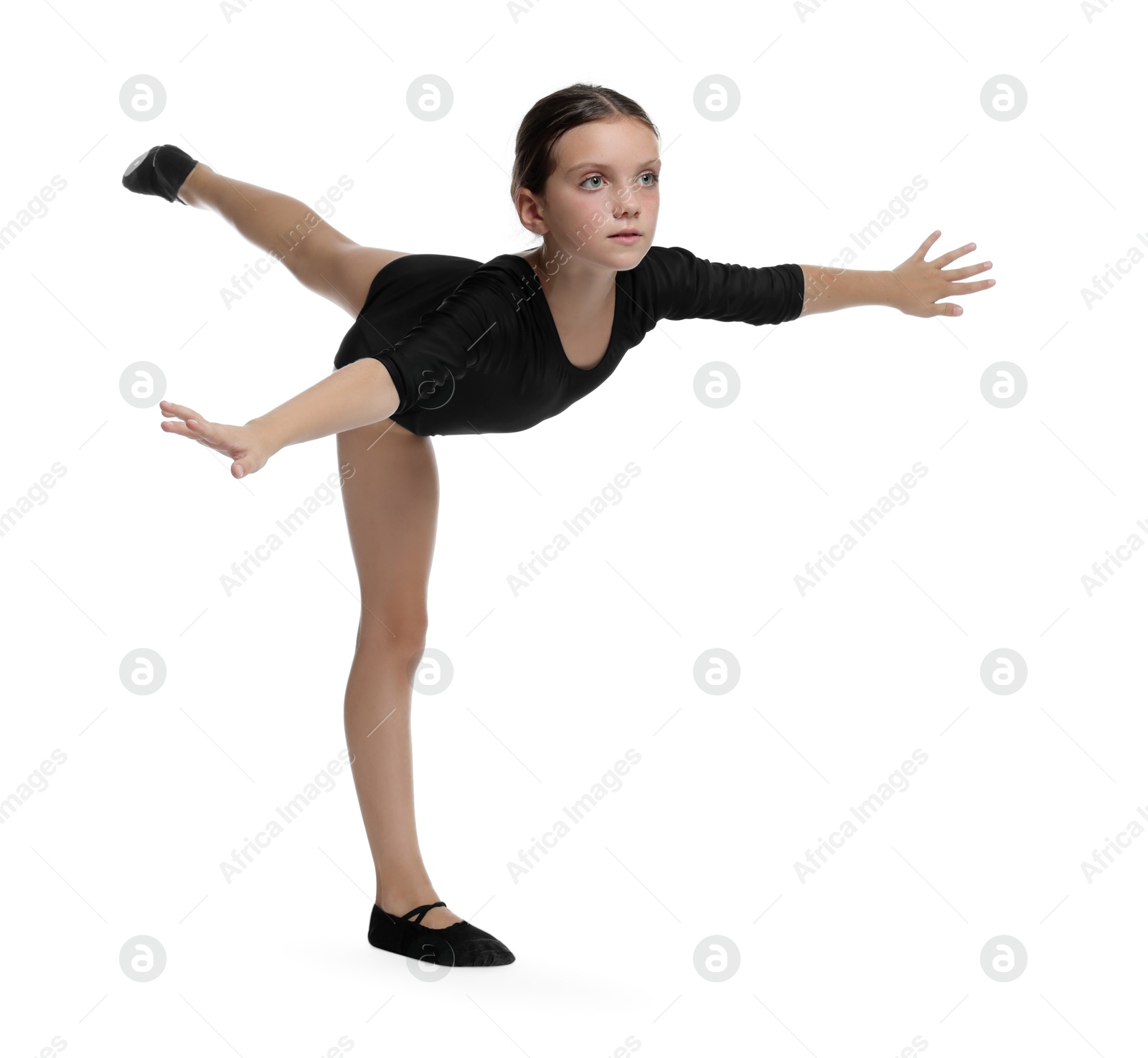 Photo of Little ballerina practicing dance moves on white background