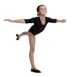 Photo of Little ballerina practicing dance moves on white background