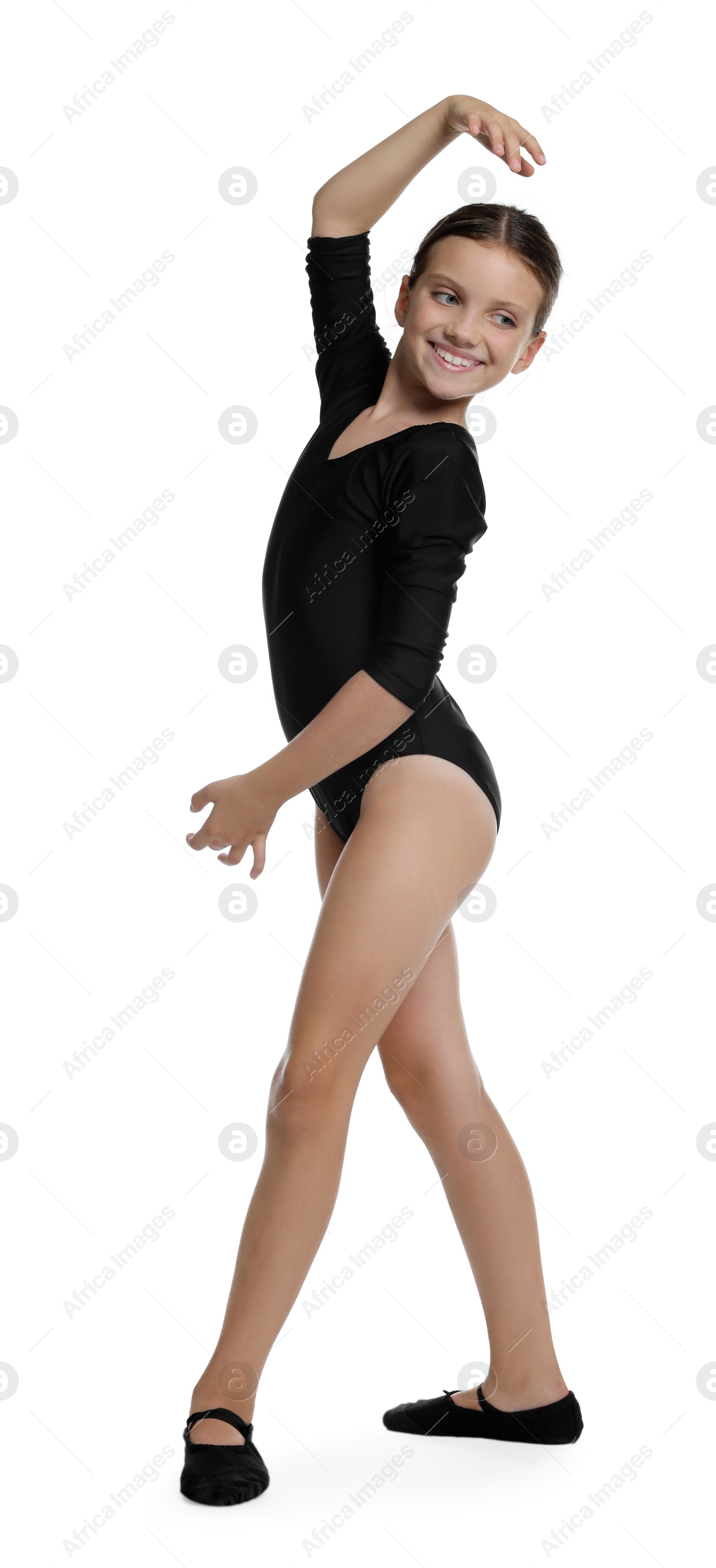 Photo of Little ballerina practicing dance moves on white background