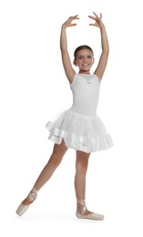 Little ballerina practicing dance moves on white background