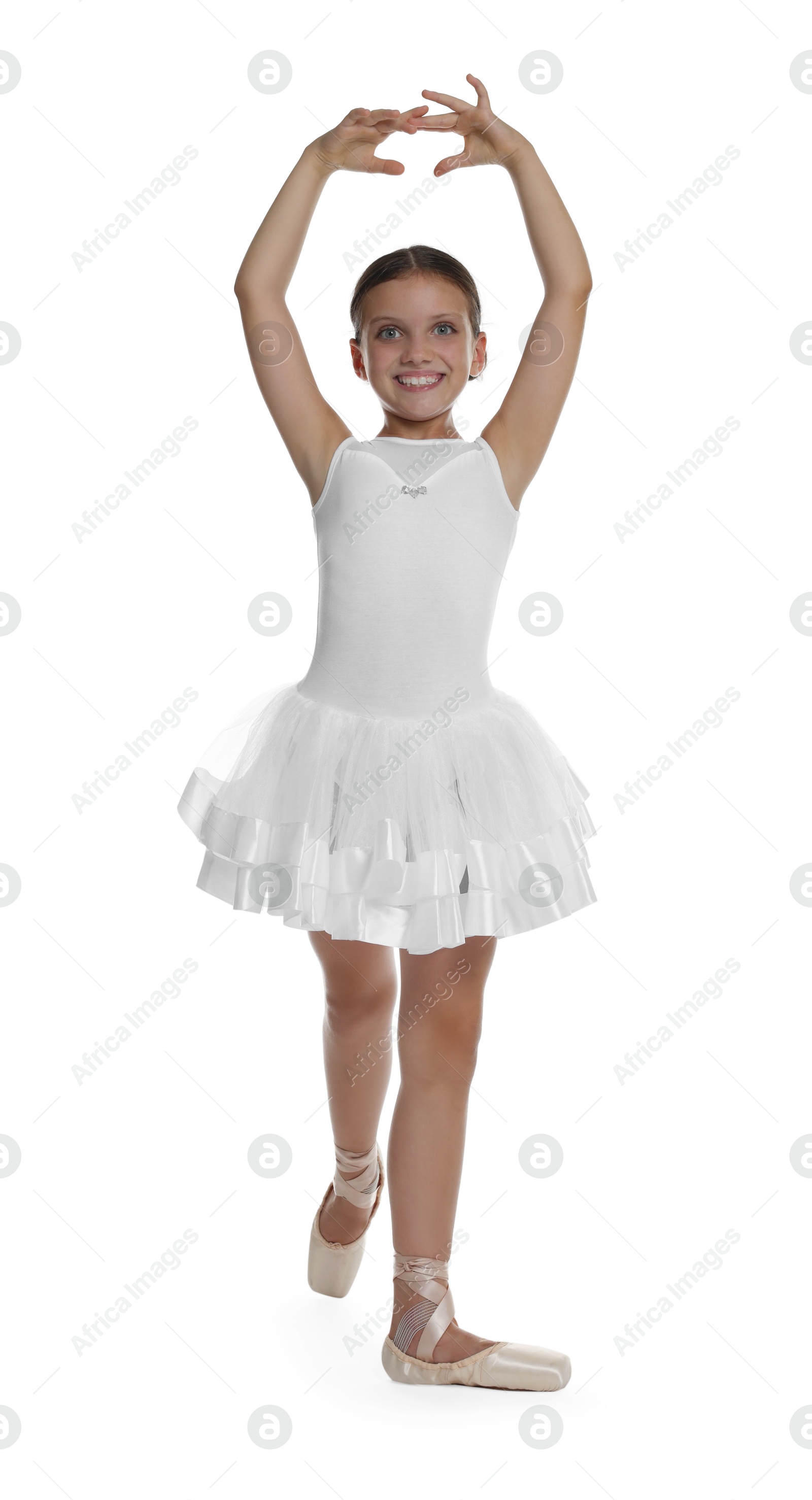 Photo of Little ballerina practicing dance moves on white background