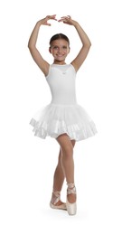 Photo of Little ballerina practicing dance moves on white background