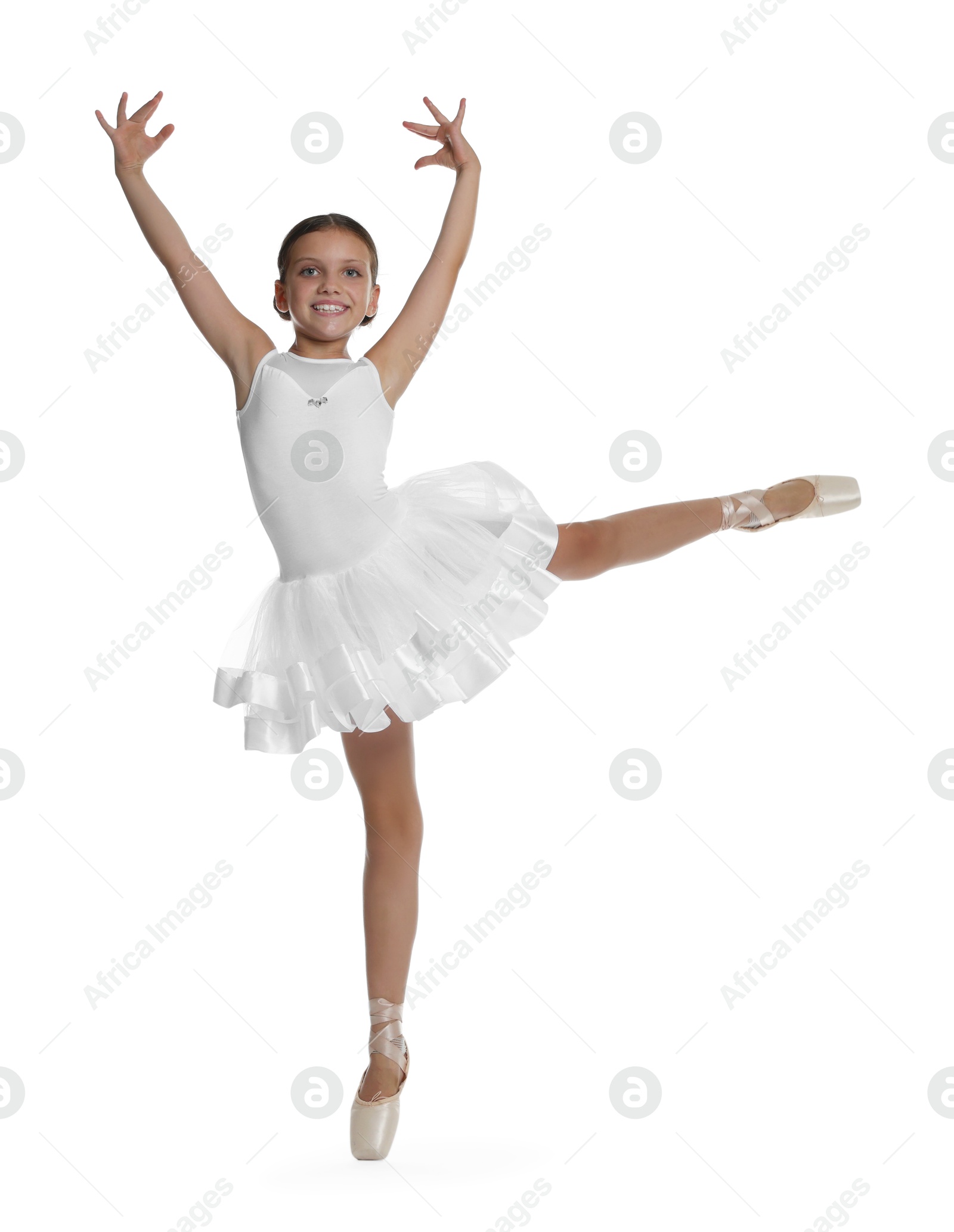 Photo of Cute little ballerina dancing on white background