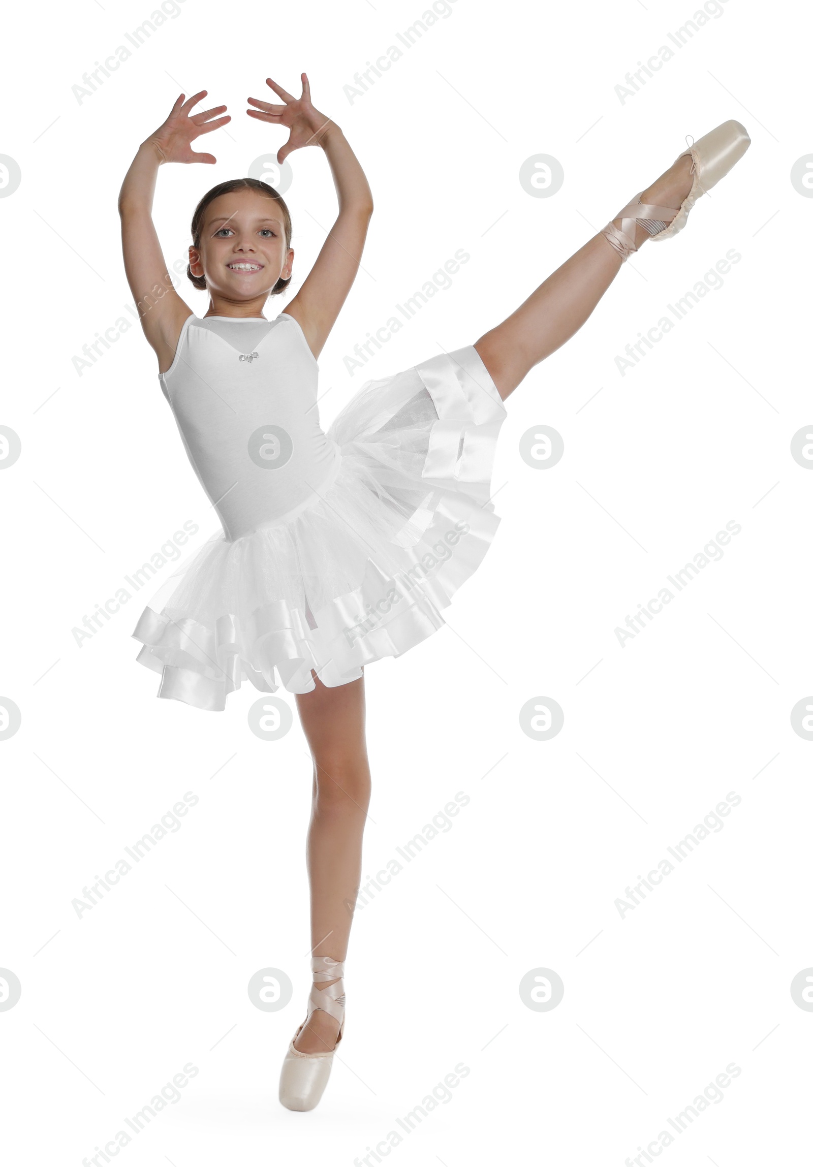 Photo of Cute little ballerina dancing on white background