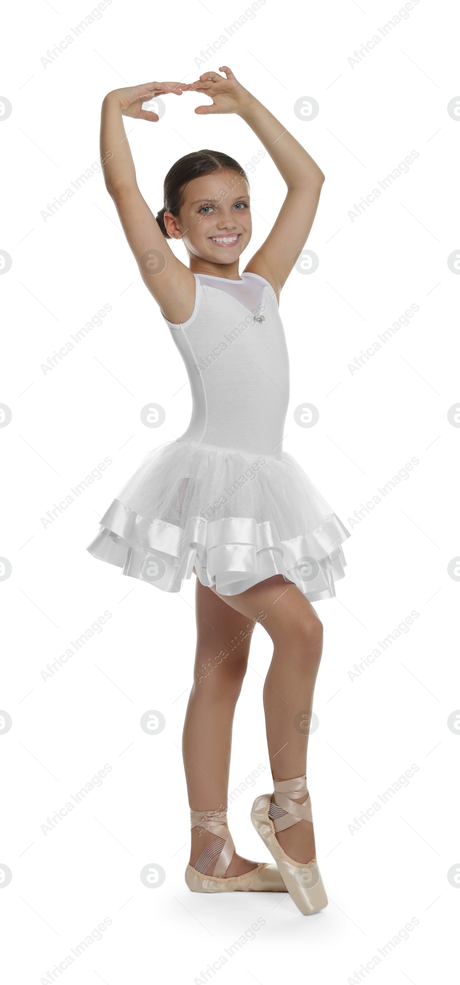 Photo of Little ballerina practicing dance moves on white background