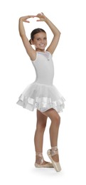 Photo of Little ballerina practicing dance moves on white background