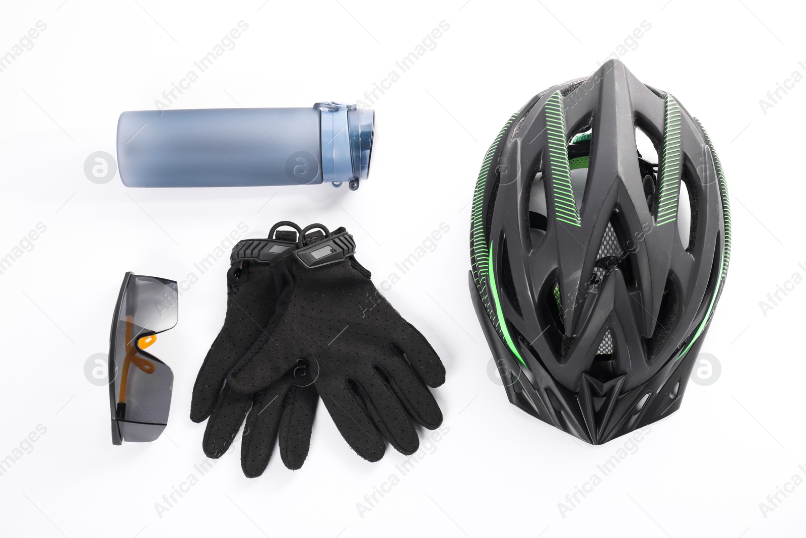 Photo of Bicycle helmet, thermo bottle, gloves and goggles on white background, flat lay