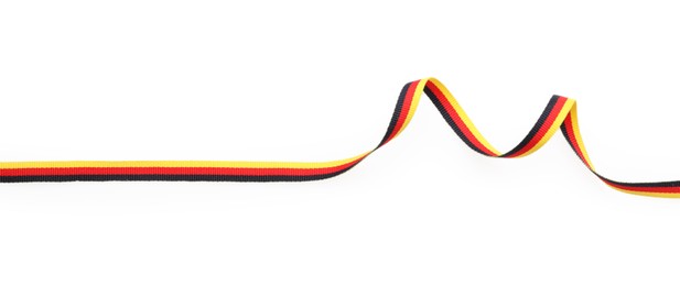 Ribbon in colors of German flag isolated on white, top view