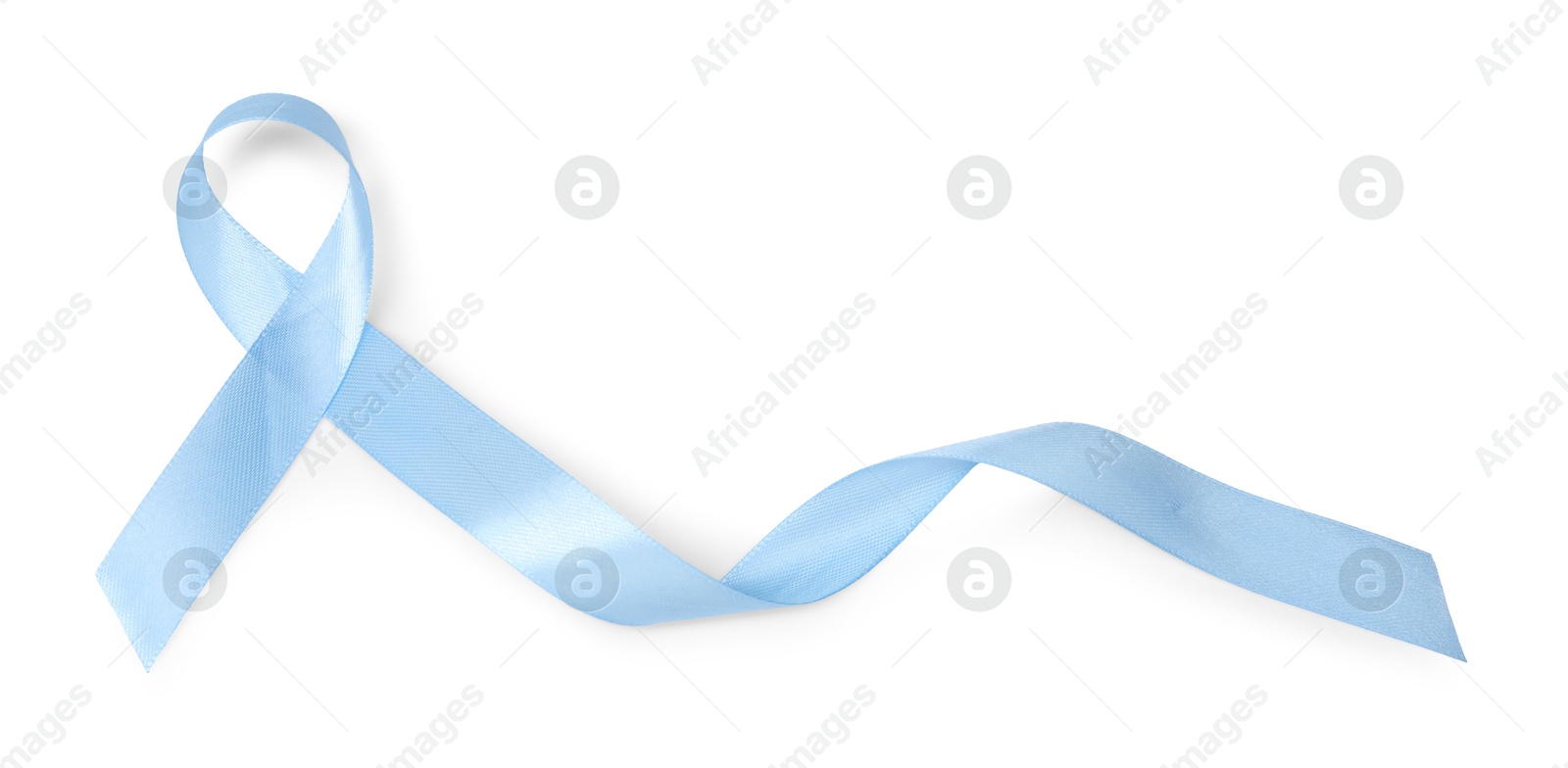 Photo of Light blue ribbon isolated on white, top view. Prostate cancer awareness