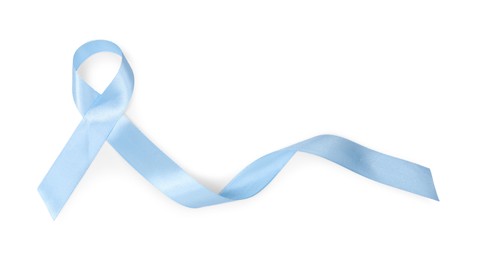 Photo of Light blue ribbon isolated on white, top view. Prostate cancer awareness