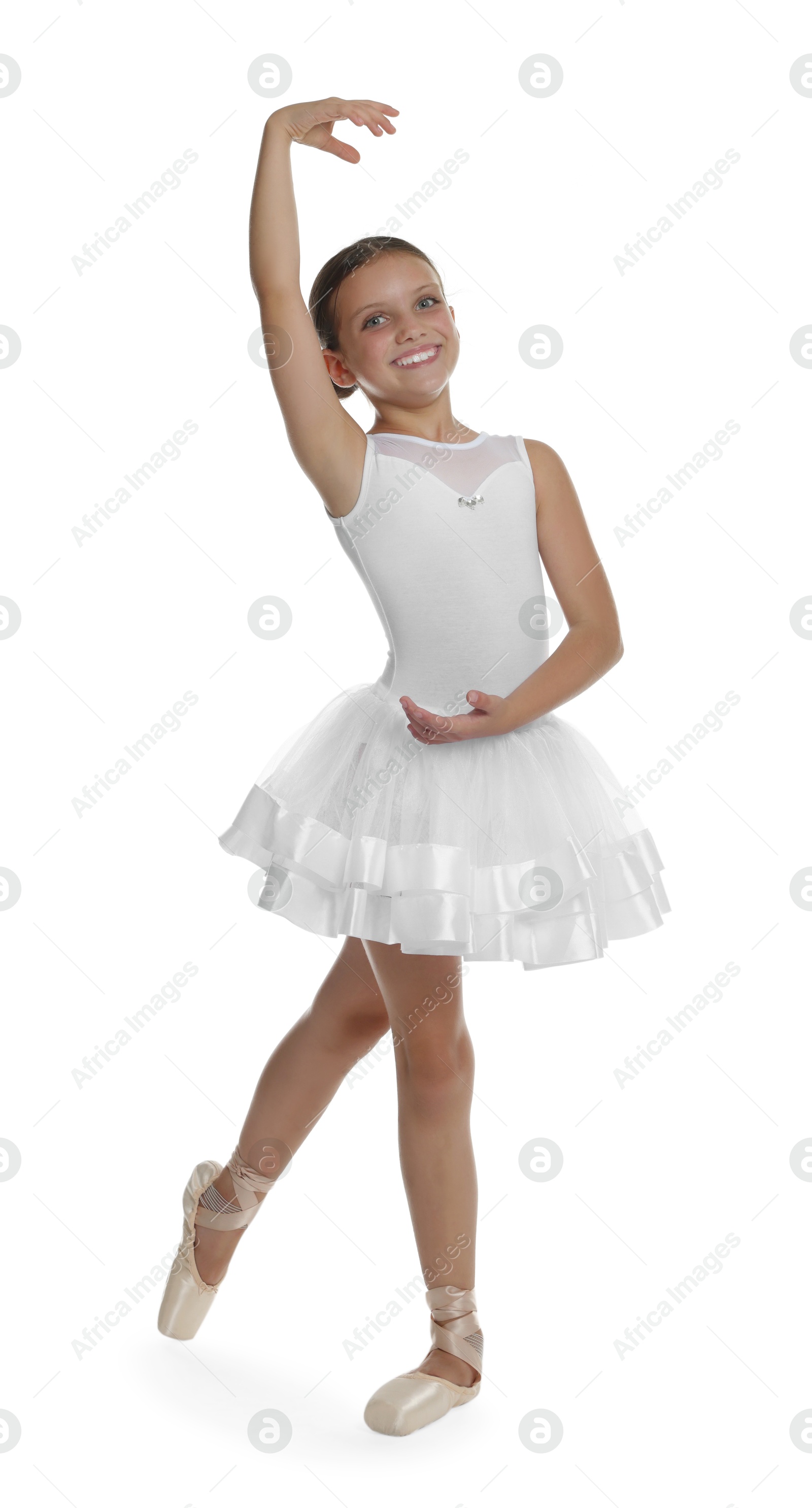 Photo of Little ballerina practicing dance moves on white background