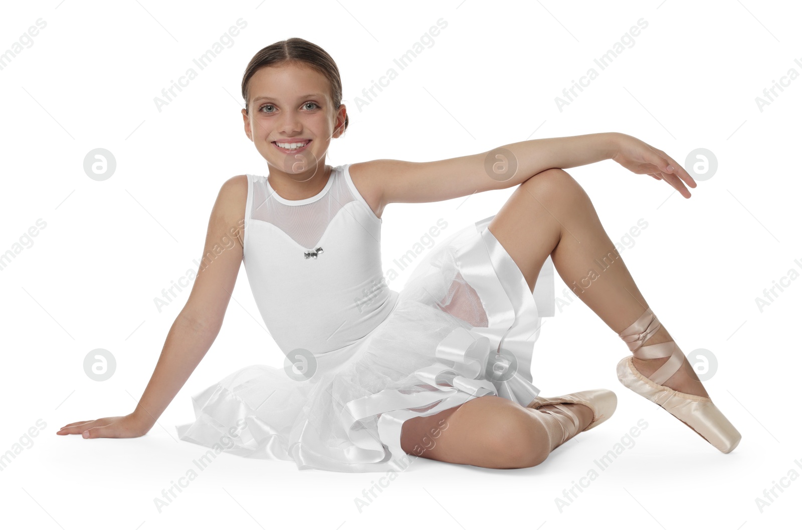 Photo of Portrait of little ballerina on white background