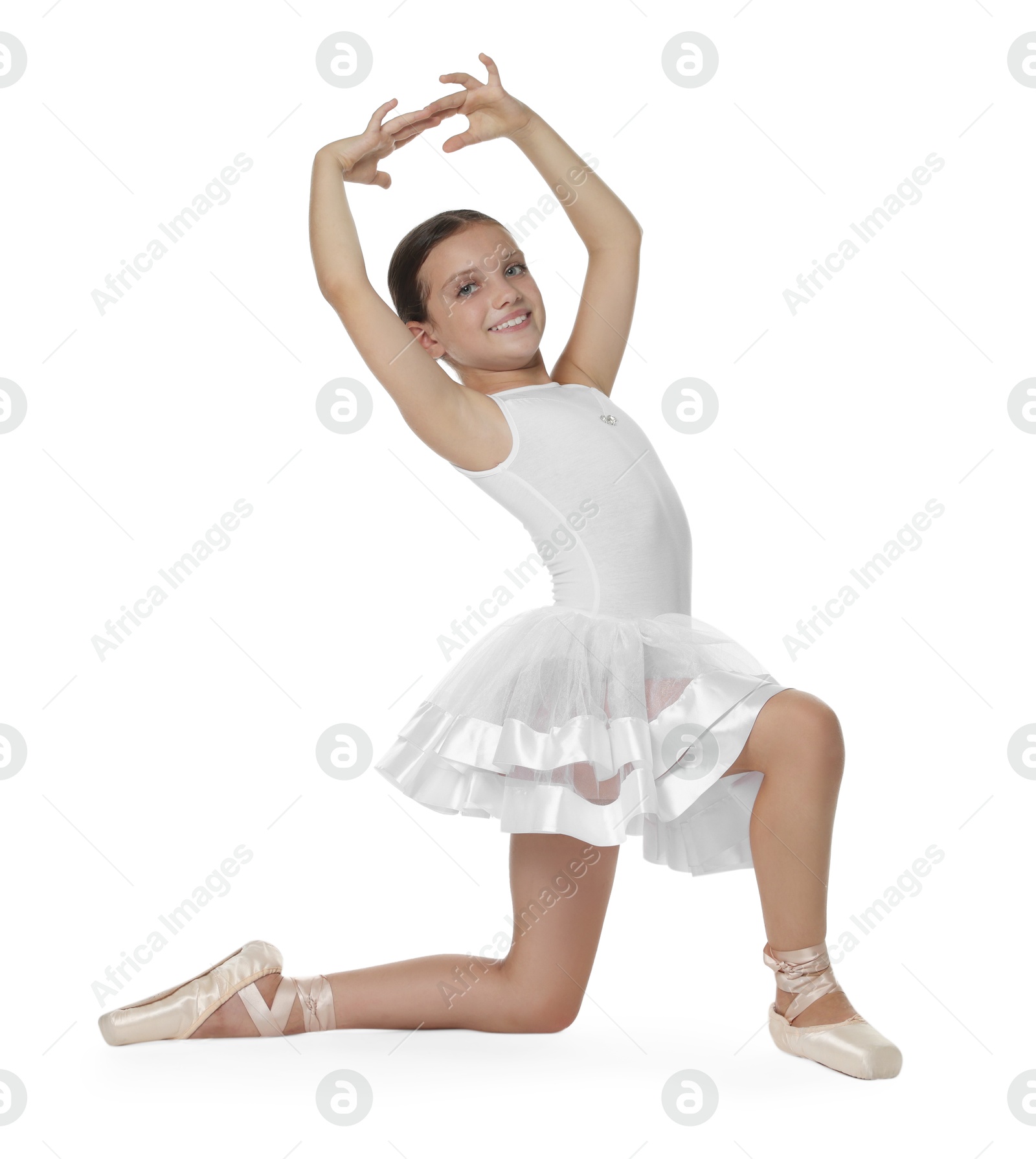 Photo of Portrait of little ballerina on white background