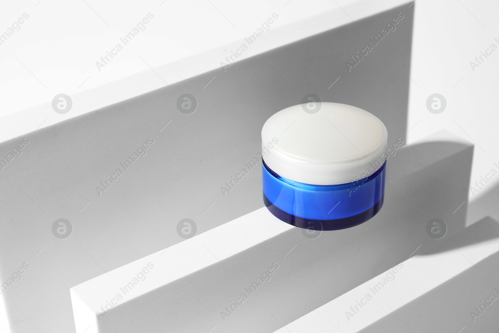 Photo of Stylish presentation of facial cream on white background