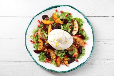 Photo of Plate with fresh burrata salad on white wooden table, top view