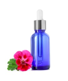 Photo of Geranium essential oil in bottle and beautiful flower isolated on white