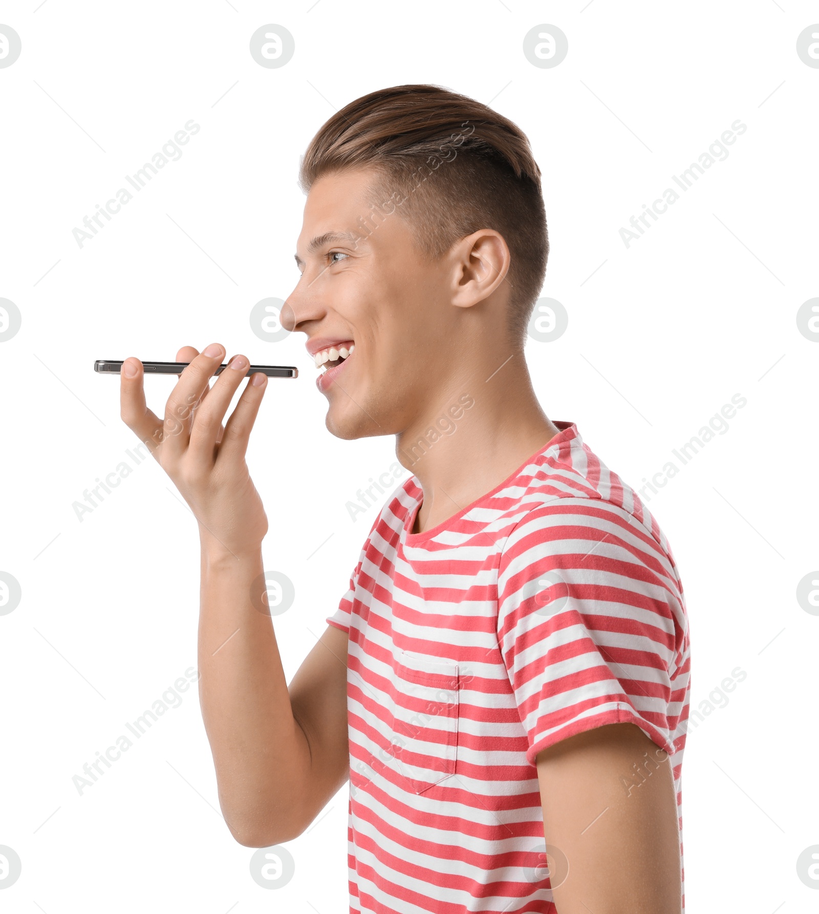 Photo of Young man recording voice message via smartphone on white background