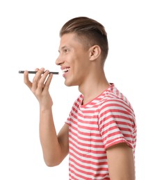 Photo of Young man recording voice message via smartphone on white background