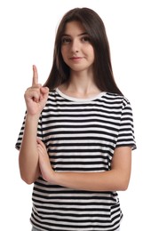 Photo of Portrait of cute teenage girl pointing at something on white background