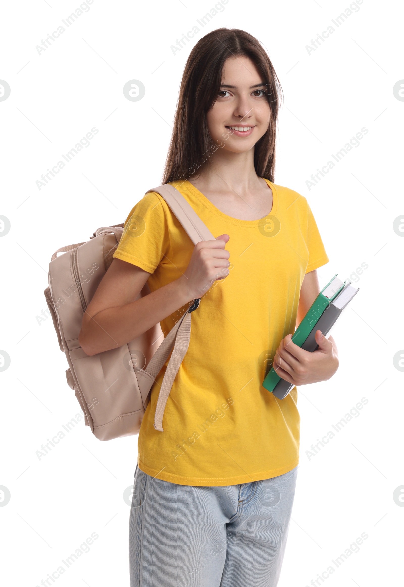 Photo of Portrait of cute teenage girl with backpack and books on white background