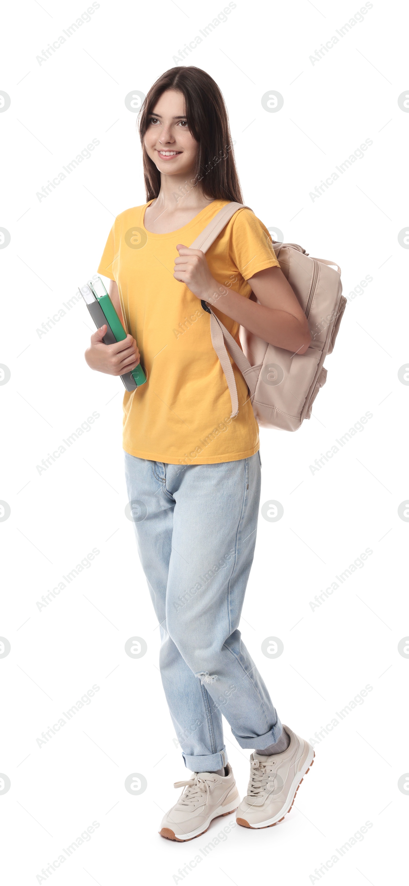 Photo of Cute teenage girl with backpack and books on white background