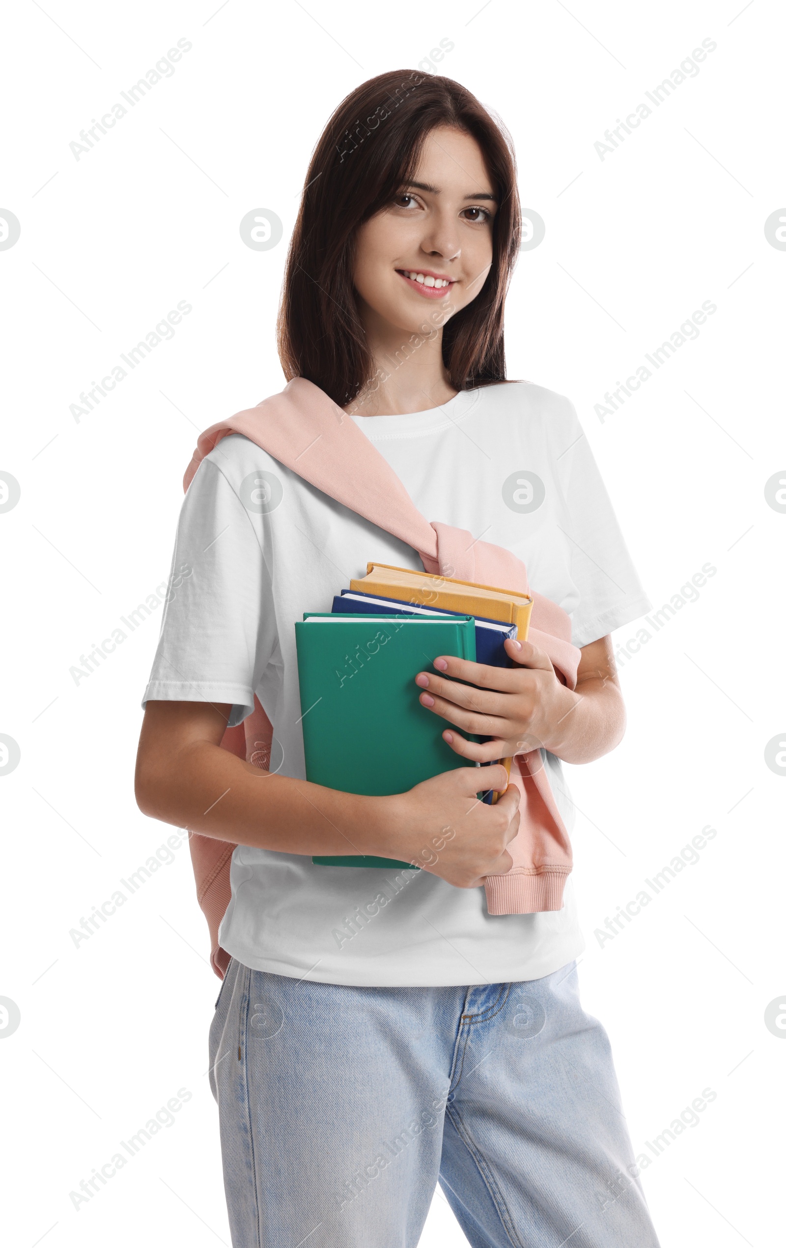 Photo of Portrait of smiling teenage girl with books on white background