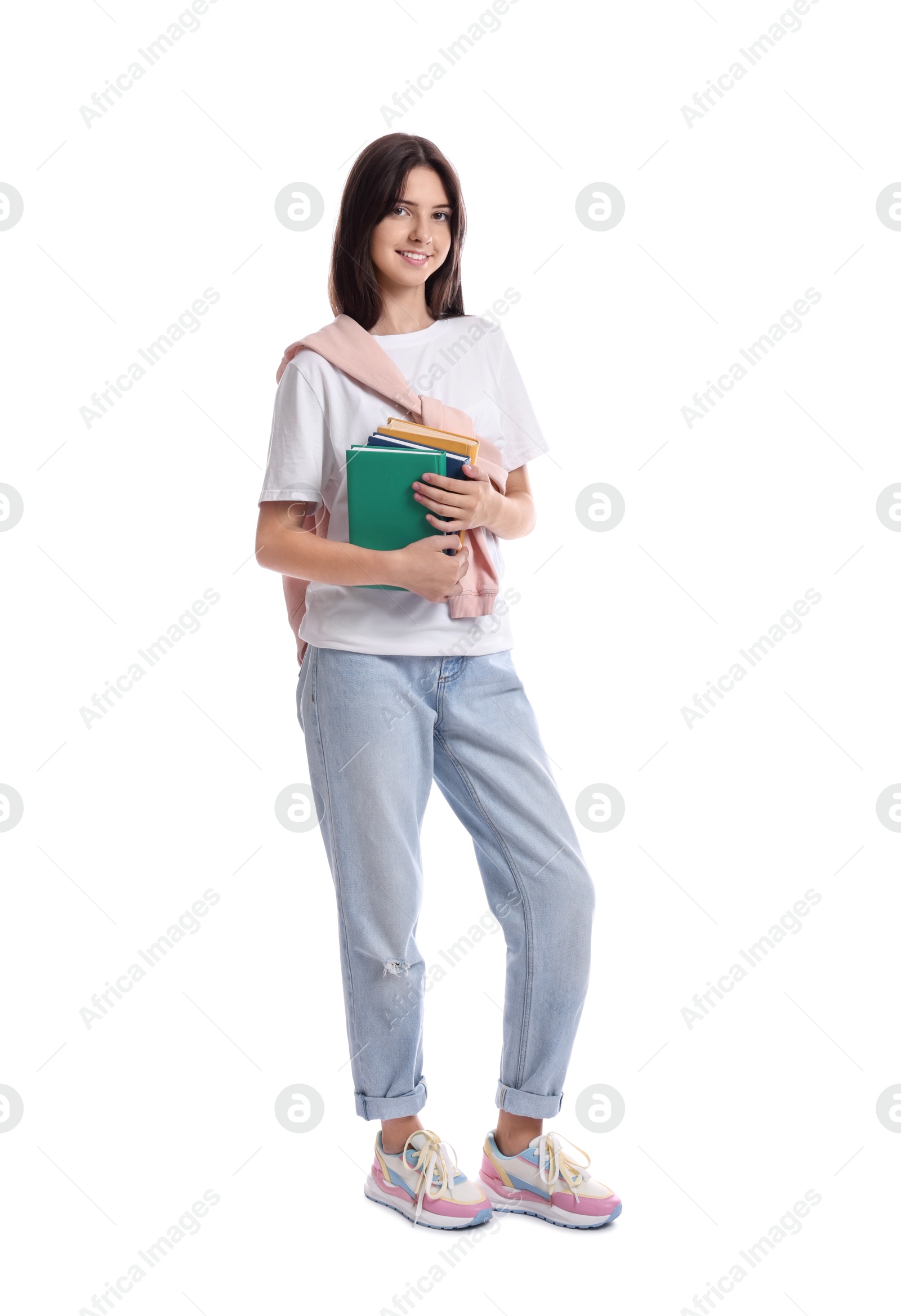 Photo of Smiling teenage girl with books on white background