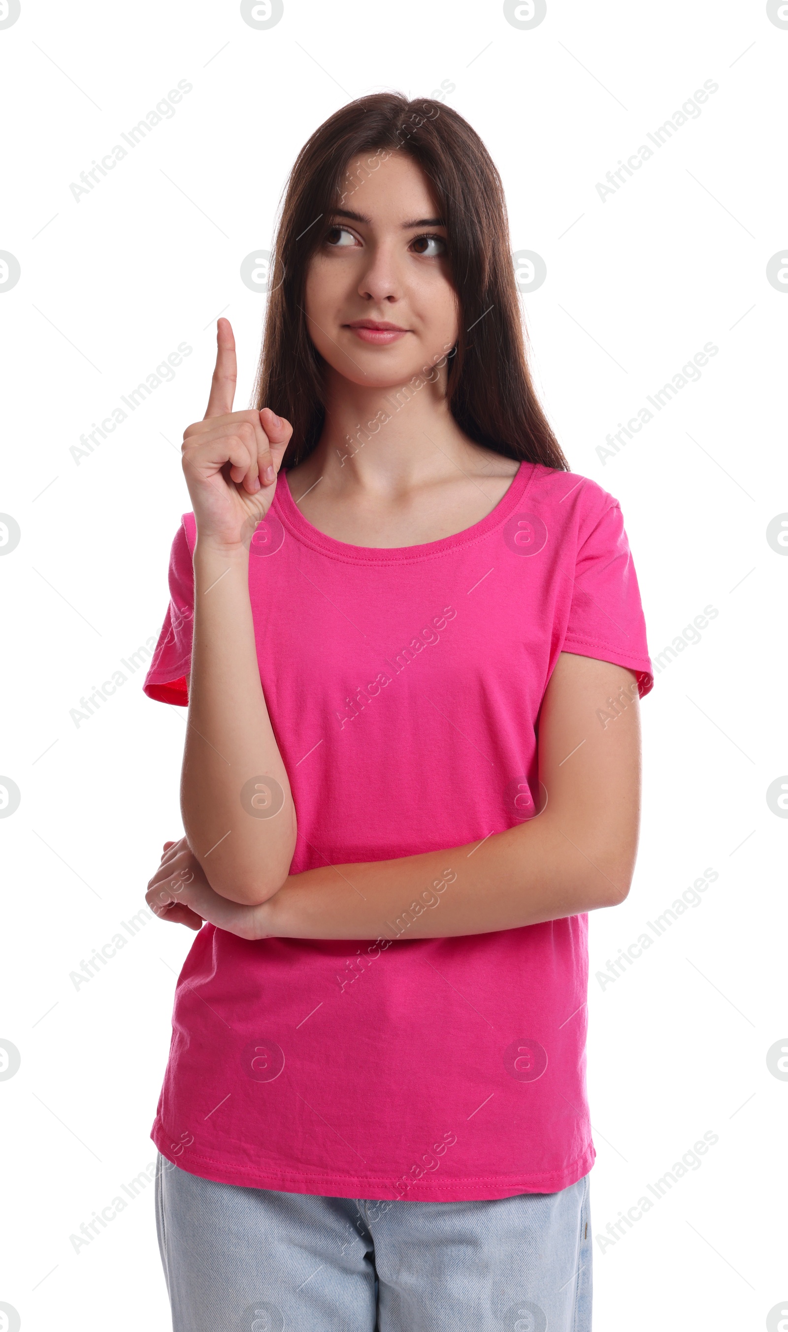 Photo of Portrait of cute teenage girl pointing at something on white background