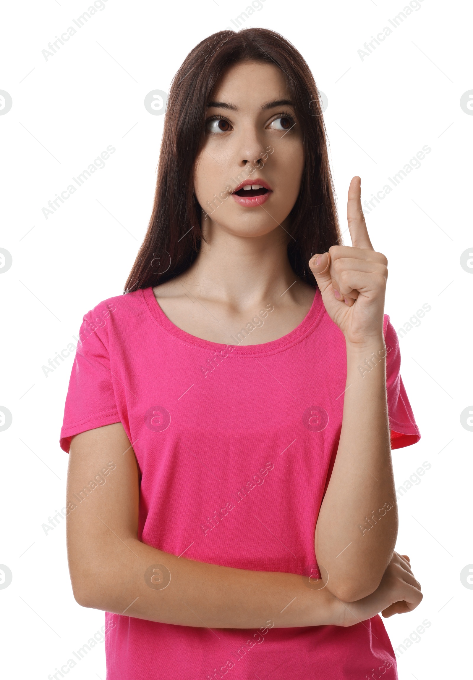 Photo of Portrait of teenage girl pointing at something on white background