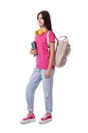 Smiling teenage girl with backpack and books on white background