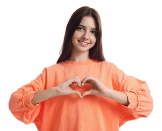 Photo of Teenage girl making heart of hands on white background