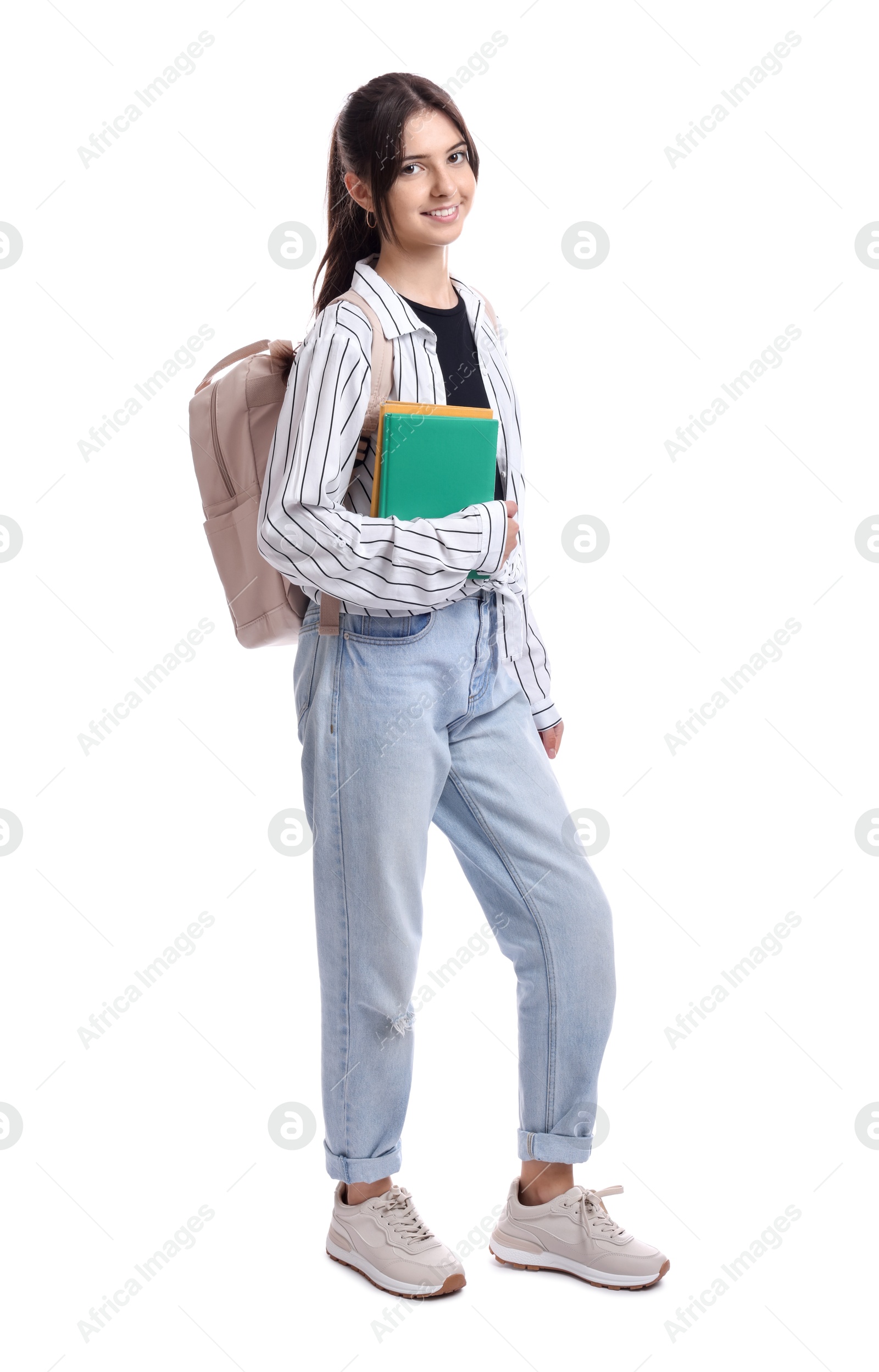 Photo of Cute teenage girl with backpack and books on white background