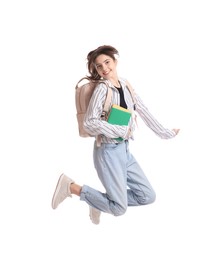 Photo of Cute teenage girl with backpack and books jumping on white background