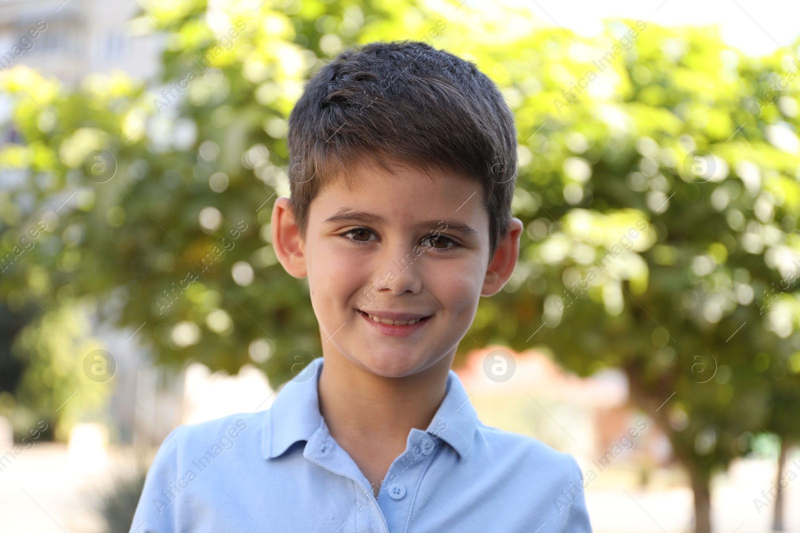 Photo of Portrait of little boy outdoors. Cute child