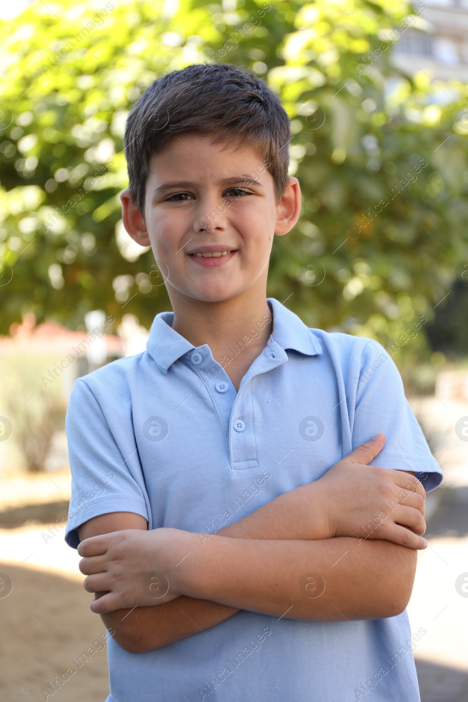 Photo of Portrait of little boy outdoors. Cute child