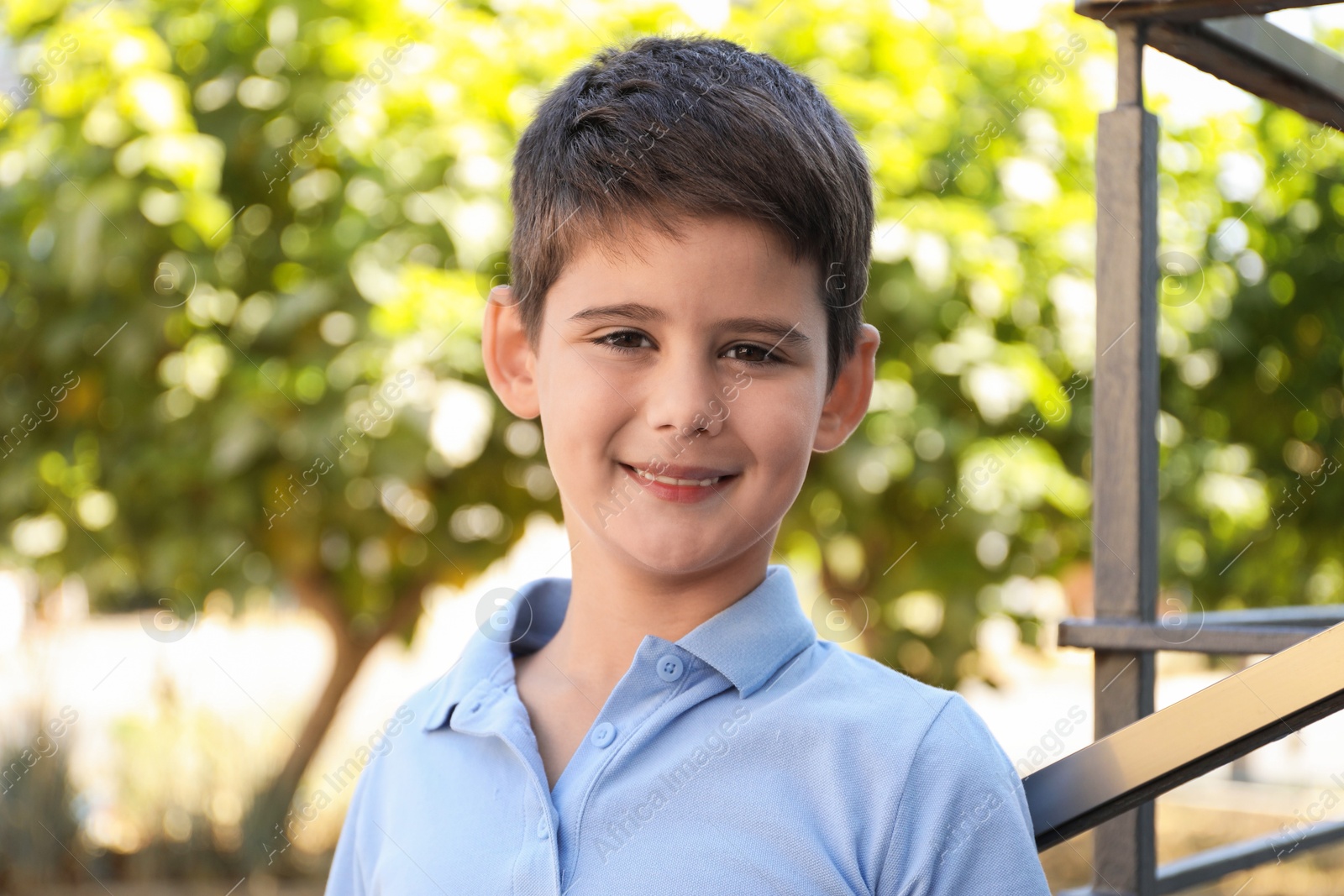 Photo of Portrait of little boy outdoors. Cute child