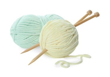 Photo of Skeins of soft yarn and knitting needles isolated on white