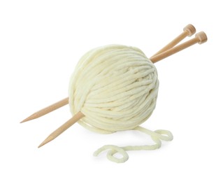 Skein of soft yarn and knitting needles isolated on white