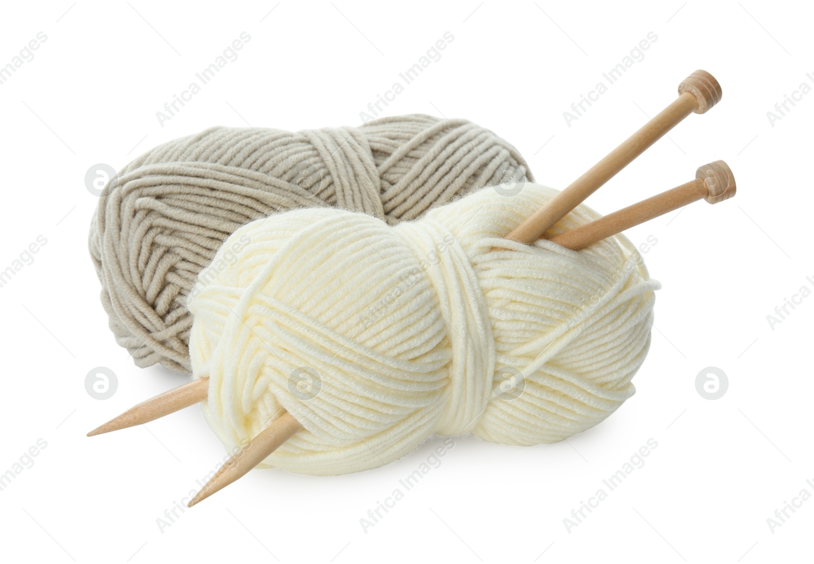 Photo of Skeins of soft yarn and knitting needles isolated on white