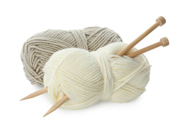 Photo of Skeins of soft yarn and knitting needles isolated on white