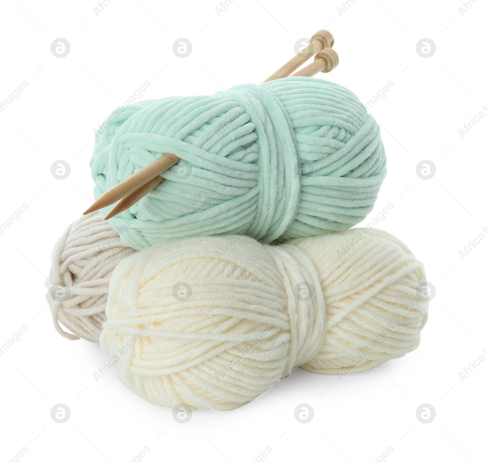 Photo of Skeins of soft yarn and knitting needles isolated on white