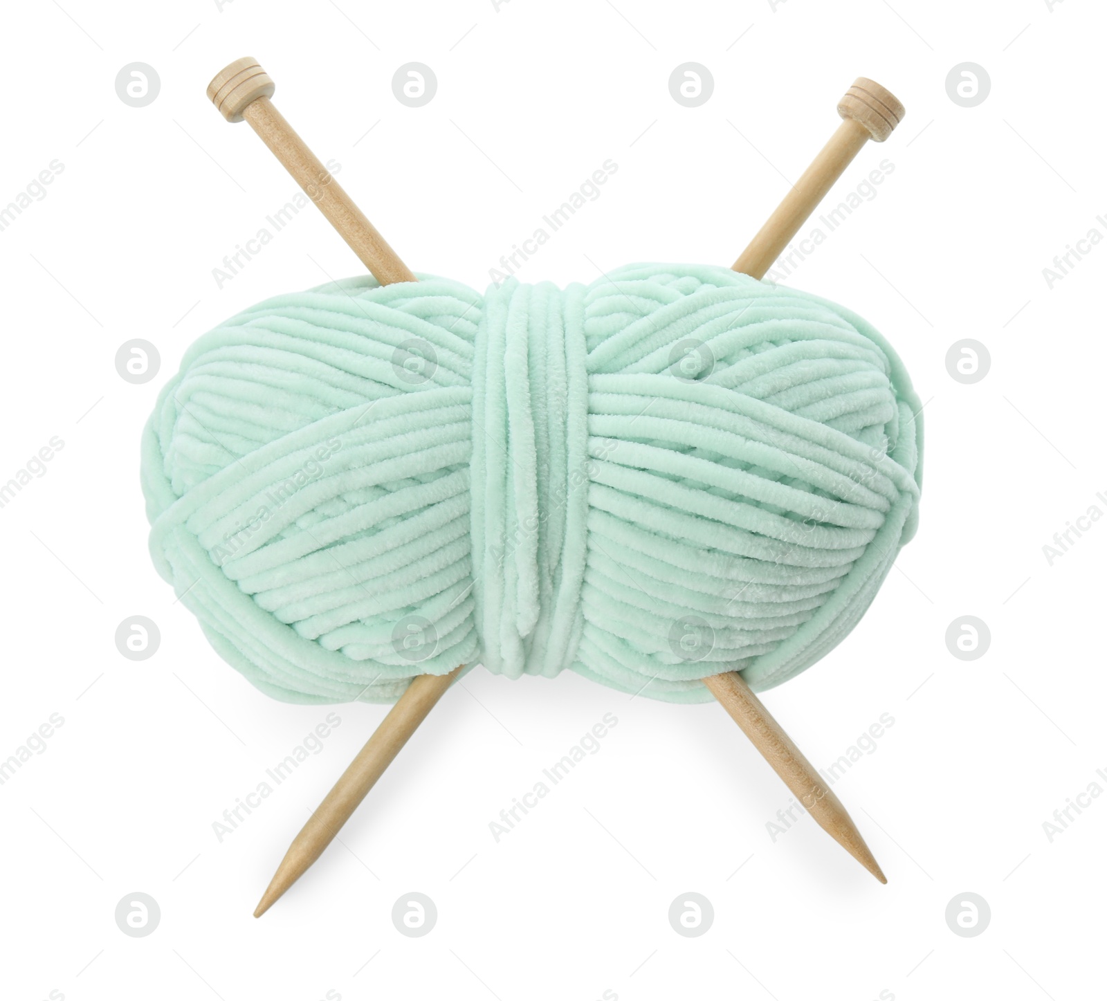 Photo of Skein of soft yarn and knitting needles isolated on white, above view