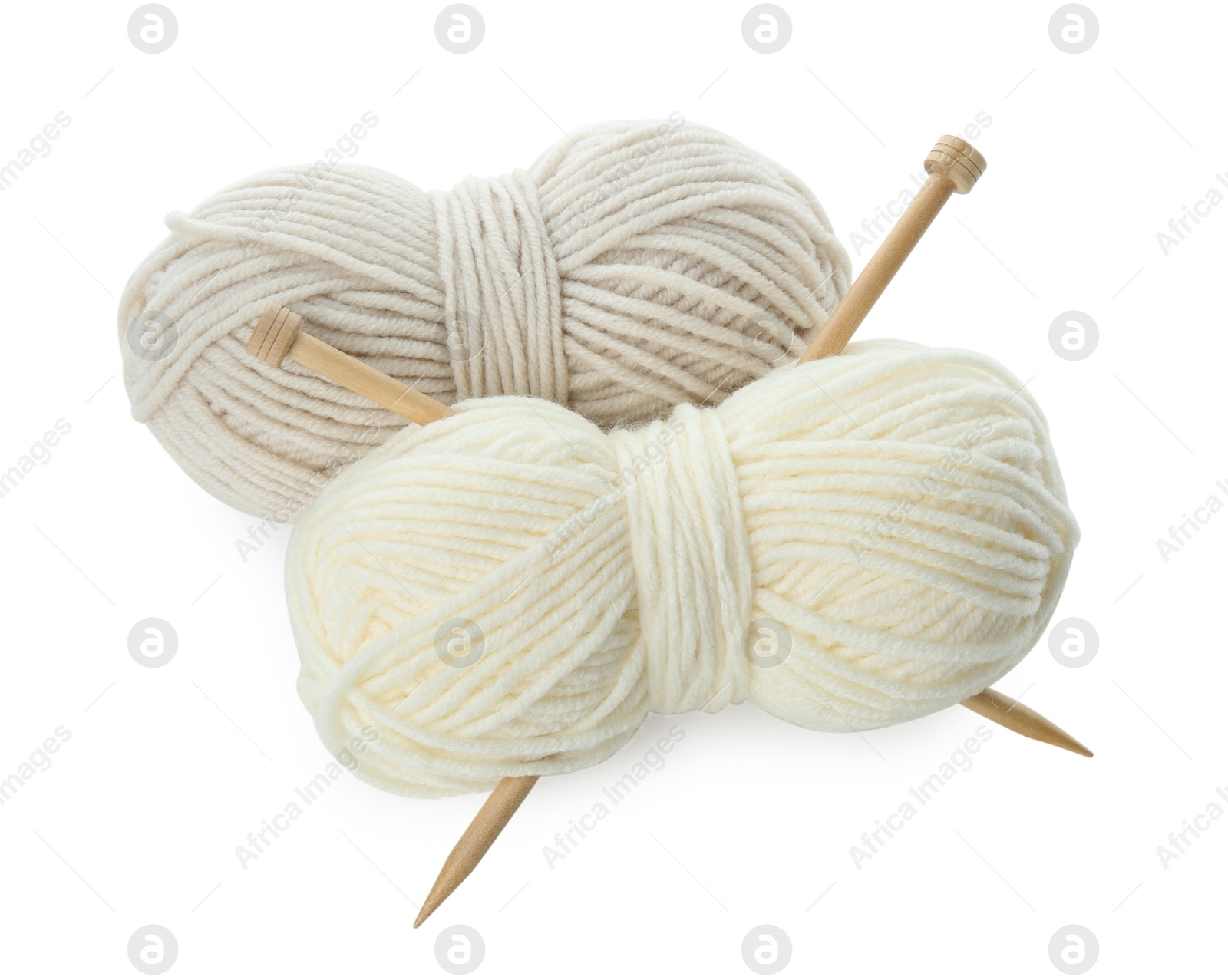 Photo of Skeins of soft yarn and knitting needles isolated on white