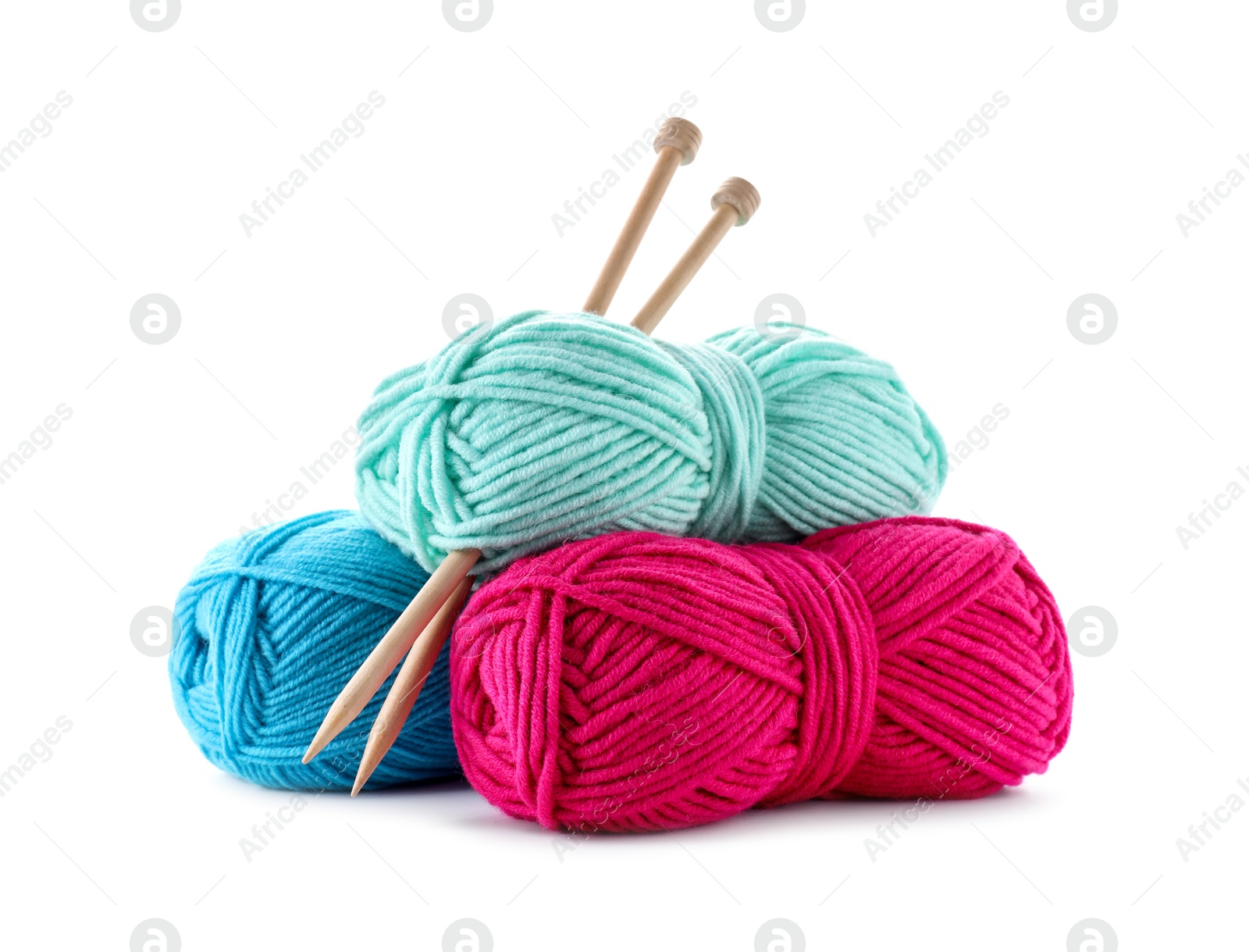 Photo of Many bright yarns and knitting needles isolated on white