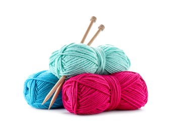 Photo of Many bright yarns and knitting needles isolated on white