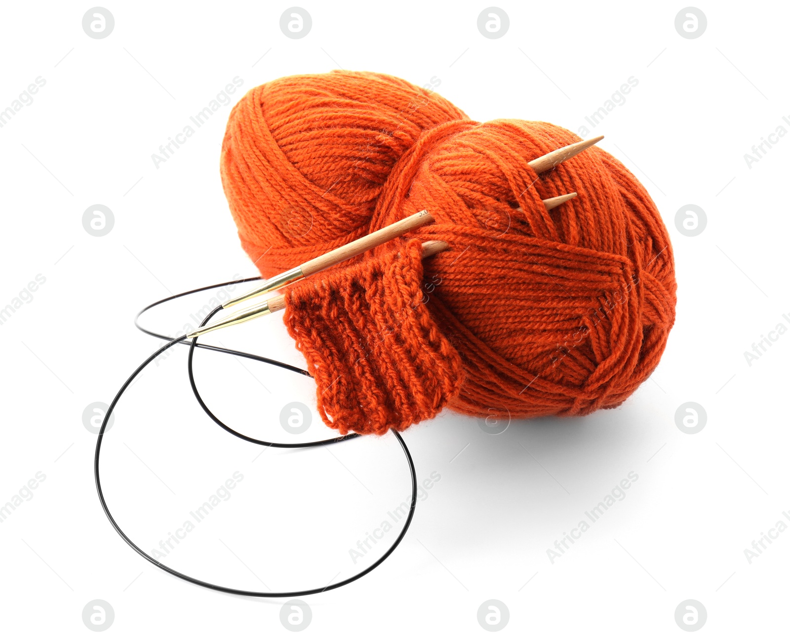 Photo of Skein of orange yarn, knitted fabric and needles isolated on white