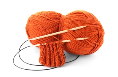 Photo of Skein of orange yarn, knitted fabric and needles isolated on white