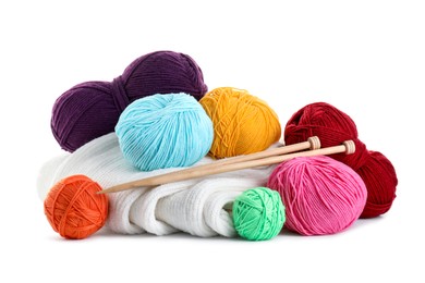 Photo of Different yarns, knitting needles and sweater isolated on white