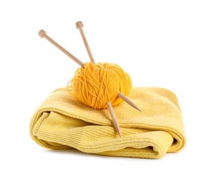 Photo of Ball of yarn with knitting needles and sweater isolated on white